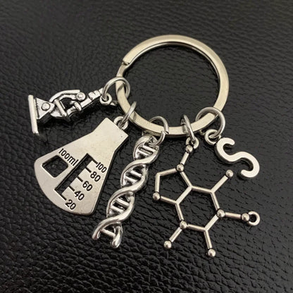 Chaveiro Científico com DNA, Erlenmeyer, Microscópio, Molécula + Letra do seu Nome